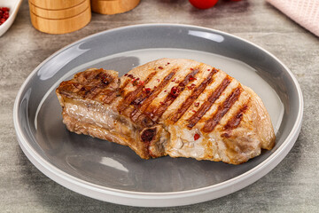 Grilled pork loin steak with bone