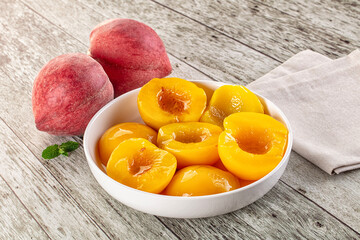 Sweet ripe yellow canned peaches