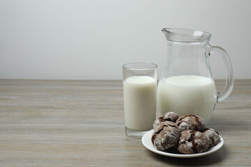 jug of milk, cornflakes on wooden background