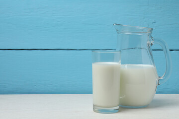 jug of milk, cornflakes on wooden background