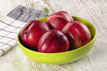 Ripe sweet juicy nectarines heap