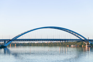 bridge across water arch shape architecture object city urban infrastructure object outskirts space river and clear weather bright day