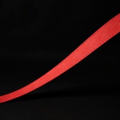 red ribbon on black background