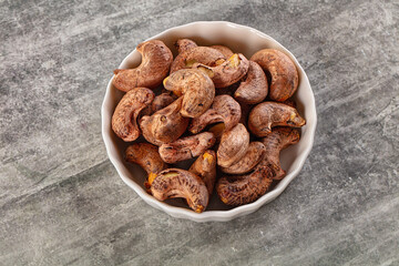 Unpeeled cashew nuts in the bowl
