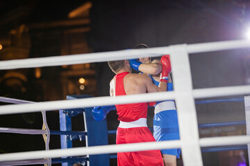 Athletes boxers fight with gloves in the ring punch hook