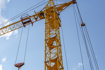 Tall building under construction with scaffolds,Freestanding tower crane on a building...