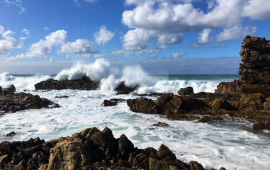 Wild seas at Mallacoota, Australia. Waves crash over rocks at Bastion Point, churning the water...