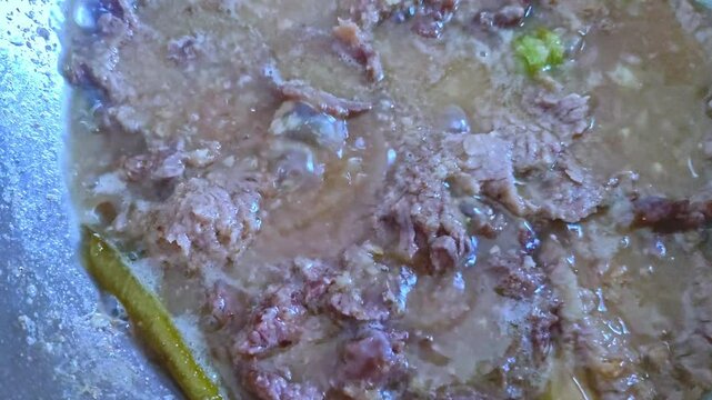 Pieces of beef jerky boiled together with basic spices consisting of shallots, garlic, candlenuts, lime leaves, lemongrass, galangal and brown sugar create an appetizing aroma.