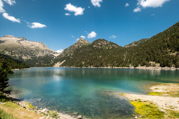 Lac d'Oredon in the French Pyrenees with the dam wall of Lac-de-Cap-Long in the distance