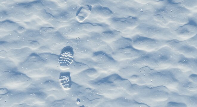 Boot prints and ripples on fresh sunlit snow detailed with sparkling ice particles