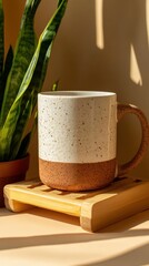 Mug mockup, with a wooden slice base with a green plant in the back of the scene