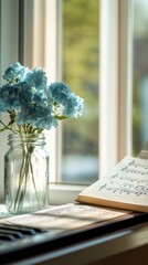 Piano, sheet music and blue flowers in glass jar on table