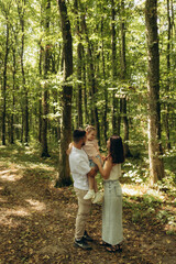 Family Enjoying Quality Time Together in a Lush Green Forest