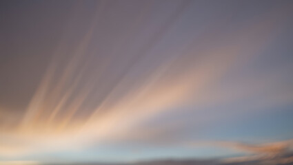 Obraz premium Soft sky rays peach and lavender clouds sunset