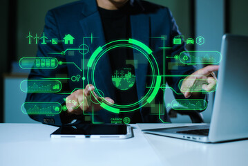 Man using futuristic interface with smart tech and mobile to manage ESG, clean energy, and...