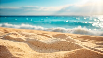 Close-Up View of Golden Beach Sand with Sparkling Blue Ocean in the Background