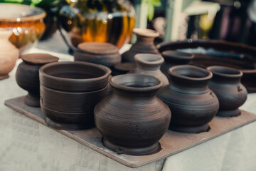 Handmade brown clay vases at workshop. Just created a pots, drying under sunlight 
