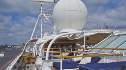 Outdoor promenade boat sun deck onboard modern luxury cruiseship cruise ship yacht liner with teak...