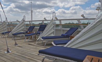 Outdoor promenade boat sun deck onboard modern luxury cruiseship cruise ship yacht liner with teak...