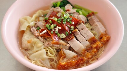 Wonton noodle with red pork and crispy pork.