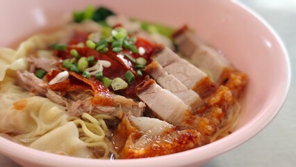 Wonton noodle with red pork and crispy pork.