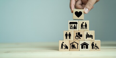 Conceptual Pyramid of Care Wooden Blocks Depicting Love, Support, and Community Services for Vulnerable People 