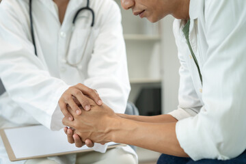 psychiatrist hold hand support each while discussing family issues. doctor encourages and empathy...