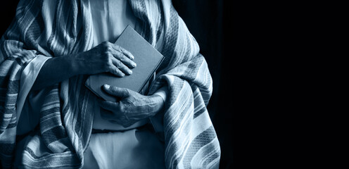 Old man holding a book