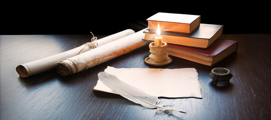 Books and candle on the table
