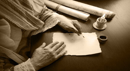 Male hand witn big quill