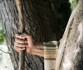Man's hand with old cane