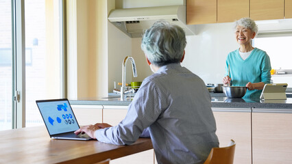 Senior couple relaxing in the dining room
