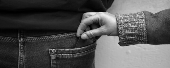 Close up old evil greed vandal felon spy black arm catch grip stole dark young kid pant loss white...