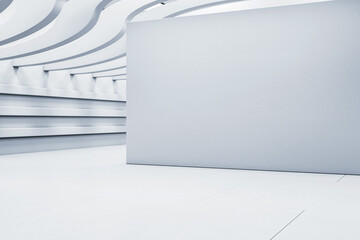 Futuristic empty showroom with wave ceiling and blank wall for mockup or display in modern...