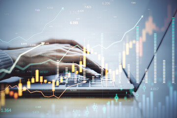 Hands typing on laptop with financial index chart overlay on light background, symbolizing digital market analysis and forex trading growth.