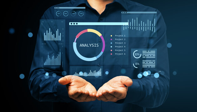 Businessman showing financial dashboard with virtual data analysis interface and charts in futuristic digital display concept on dark background.