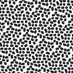 The texture consists of small spots, ovals and dots with circles.