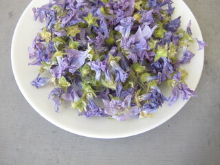 Dried mallow flowers on a small plate