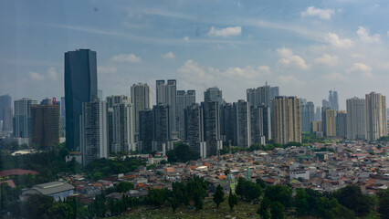 Fototapeta premium Modern Skyscrapers and Residential Housing in Jakarta Cityscape, Indonesia