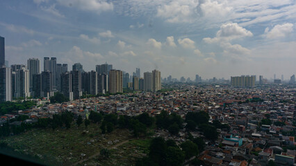Modern Skyscrapers and Residential Housing in Jakarta Cityscape, Indonesia