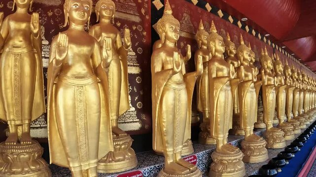 Group of standing Buddha statues situated in Wat Sri Donsak, Bokeo province of Laos. Lao Buddhism is a unique version of Theravada Buddhism and is at the basis of ethnic Lao culture.
