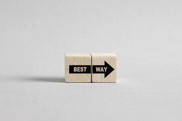 Best way forward shown by arrow on wooden blocks guiding towards success