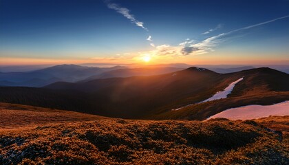 Golden sunrise over snow-capped peaks and grassy ridges in the Carpathian Mountains of Ukraine. A tranquil minimalist landscape blending soft light, shadows, and natural textures of winter.