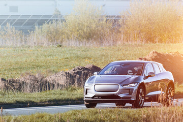 Electric car on empty country road