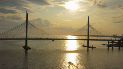 Cable-stayed bridge and new skyscraper at sunset