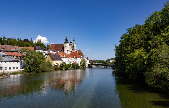 Scenic view of B�rgerspitalskirche and Michaelerkirche by the Enns River in Steyr, Upper Austria