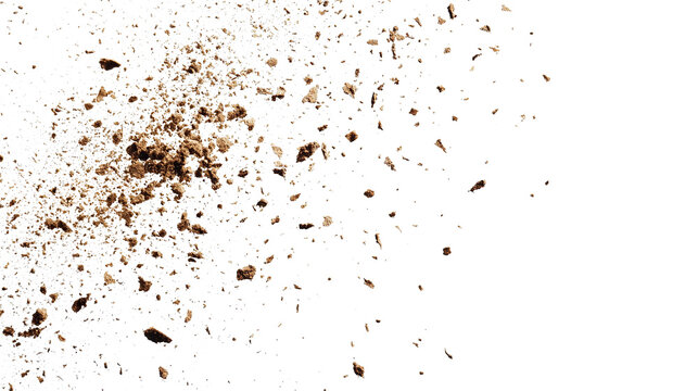Loose soil falls gracefully small dirt flakes on a transparent background. PNG