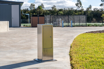 A stainless steel utility service cabinet installed in a modern public park in Australia. Designed...