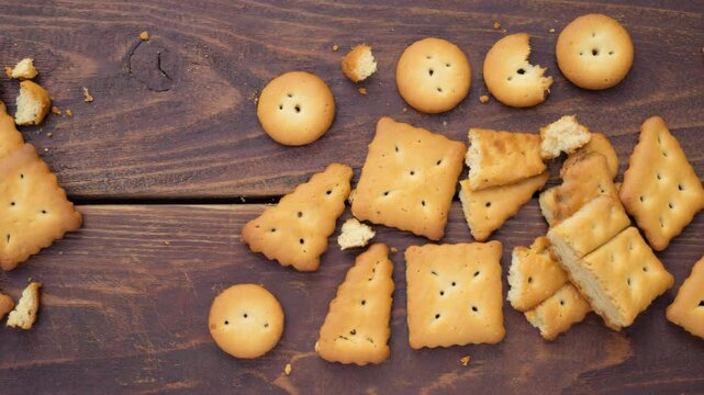 Traditional spice cookies, Speculoos, Crumble cookies on a rustic wooden surface, Warm brown tones with spices, Natural light
