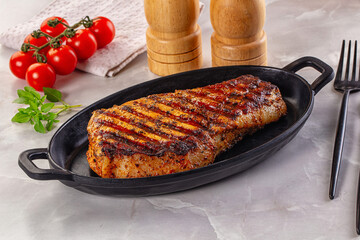 Grilled pork steak with bone